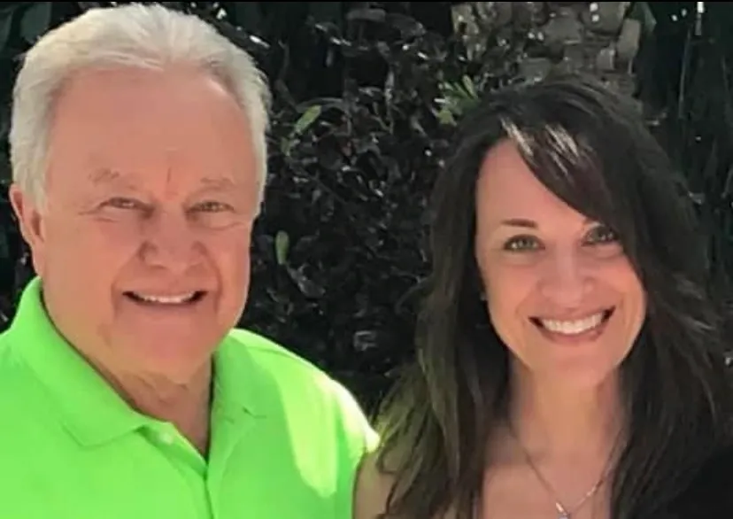 A man and woman standing next to each other.